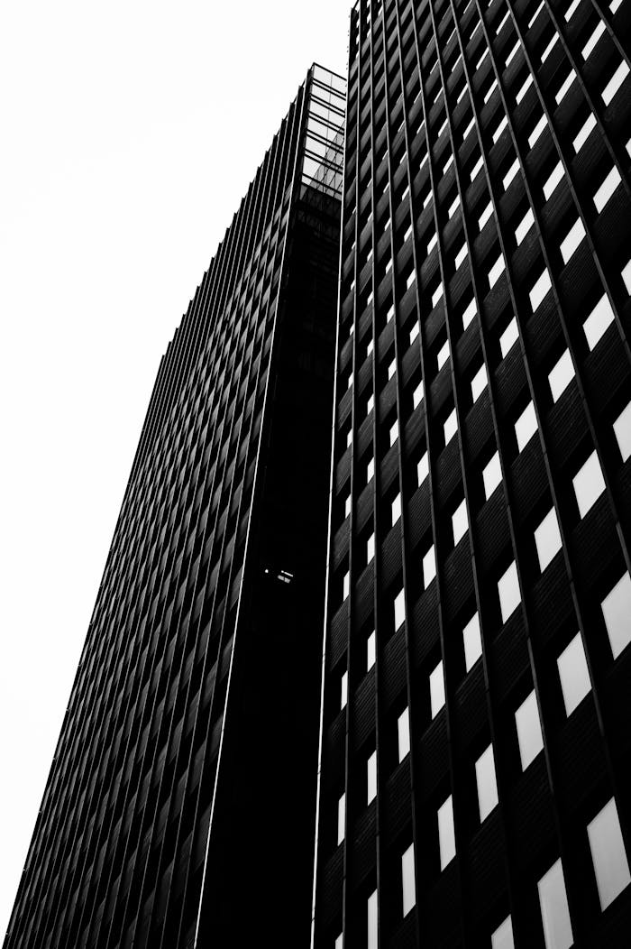Dramatic black and white shot of towering skyscrapers in urban Oslo.