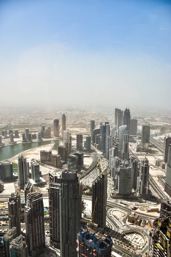 A stunning aerial view of Dubai's skyline with towering skyscrapers and a modern urban landscape.